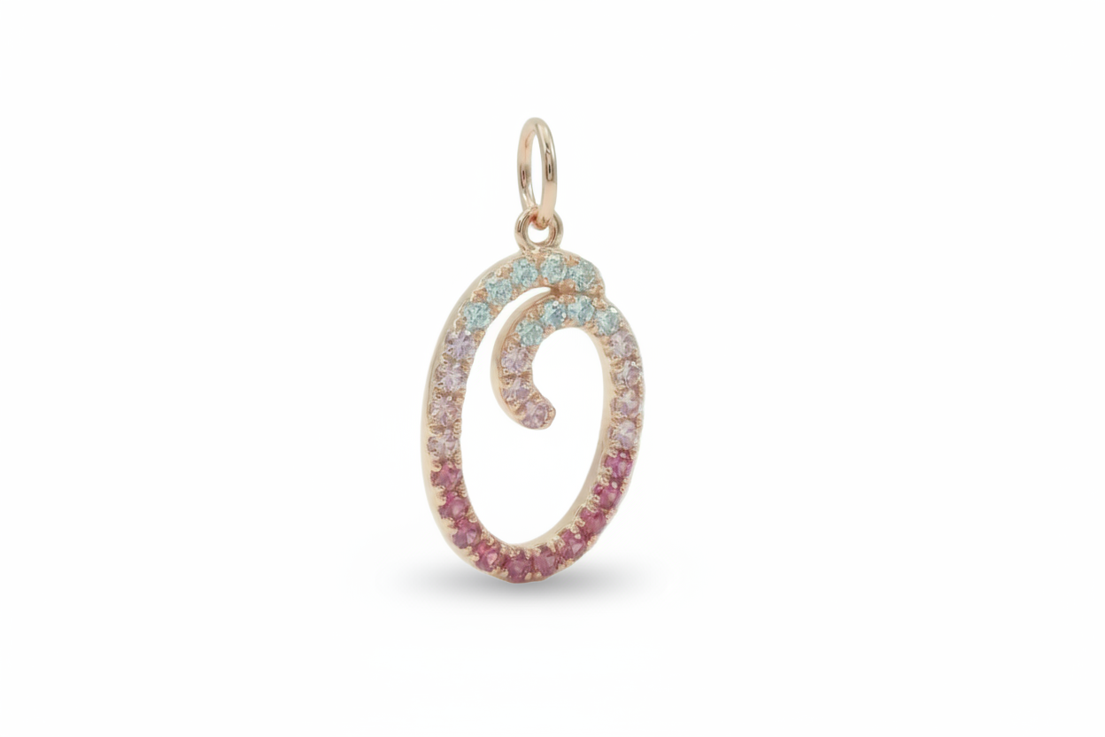 Jewelry pendant with multicolored gemstones on a white background