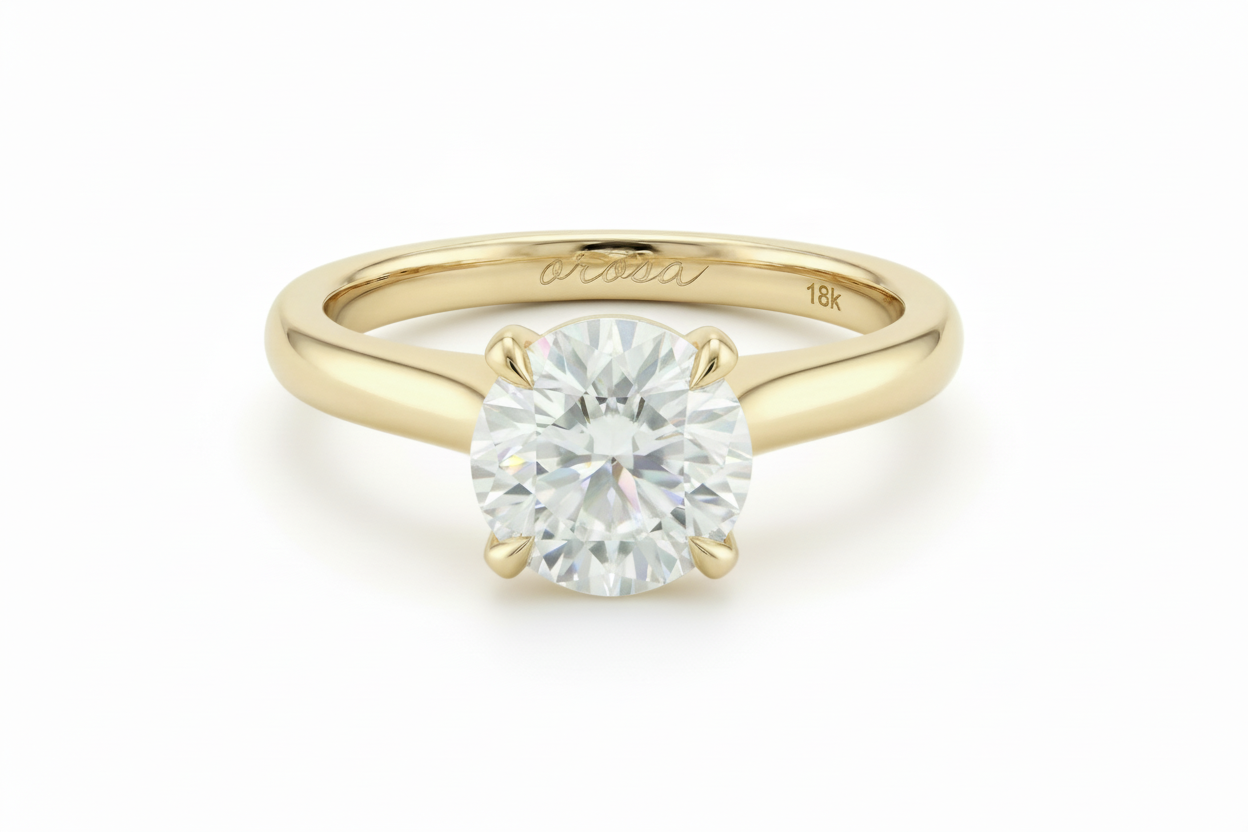 18k Gold ring with a diamond on a light beige background