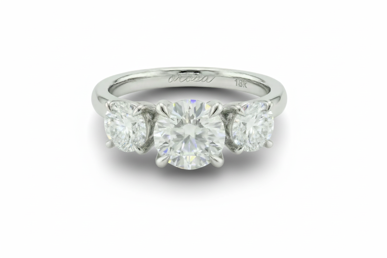platinum ring with three diamonds on a white background