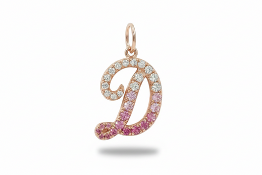 Jewelry pendant with pink and clear stones on a white background