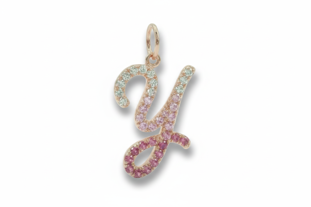 Letter 'Y' pendant with gemstones on a white background