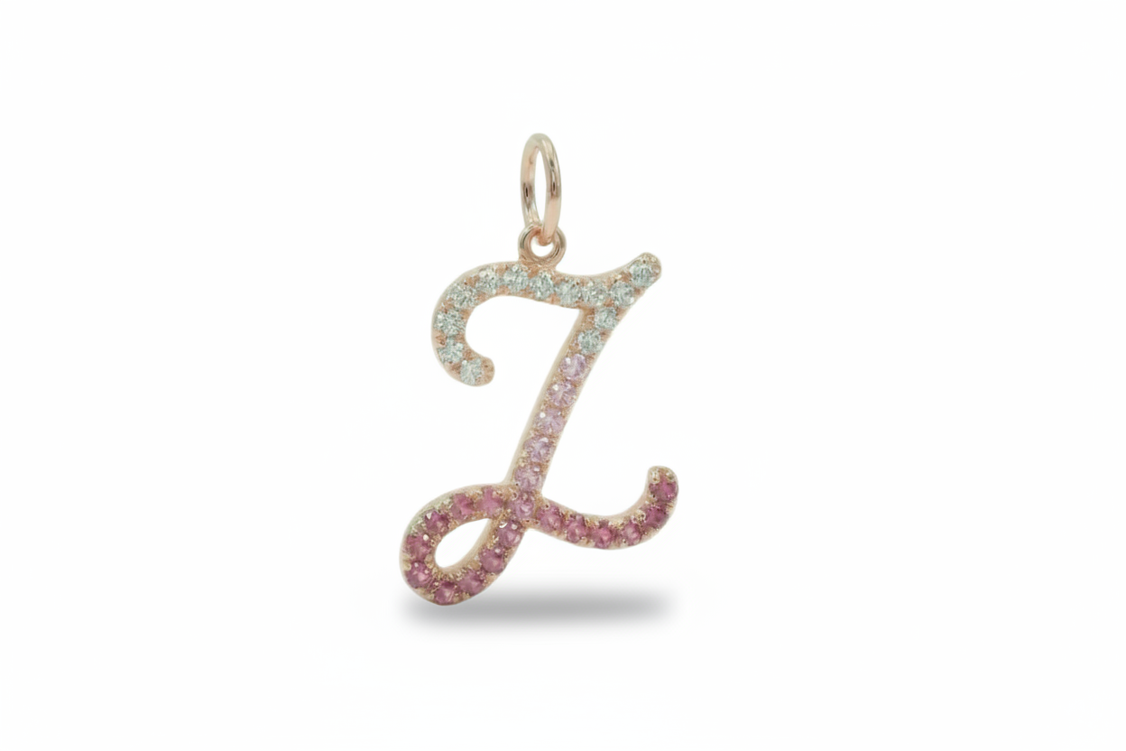 Rose gold letter 'Z' pendant with pink gemstones on a white background